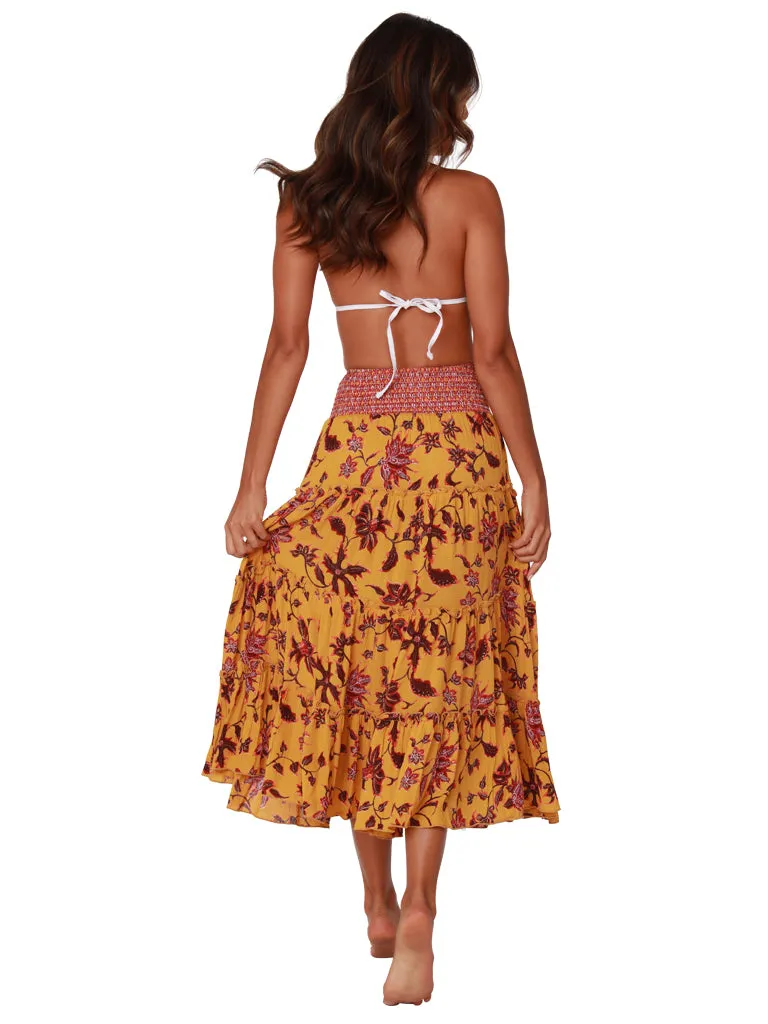 Smocked waist ruffle skirt in a vividly printed floral